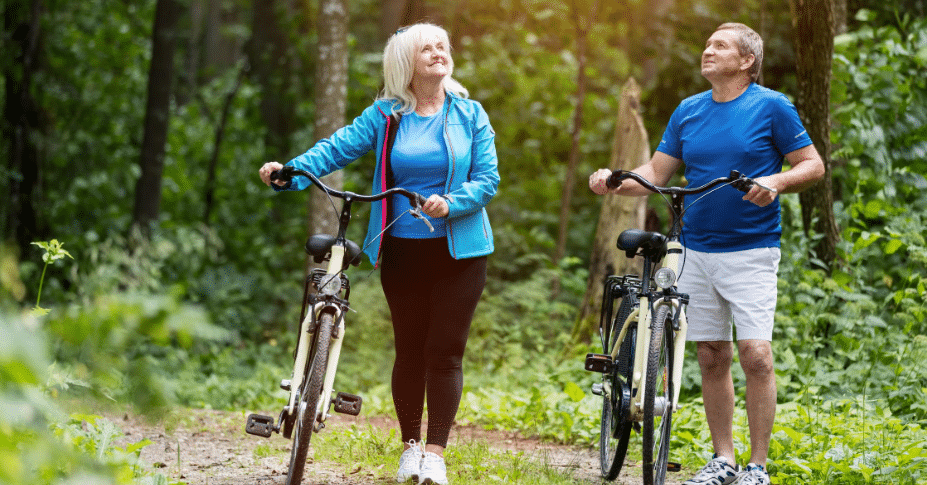 elderly couple riding bikes in retirement