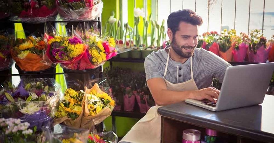 Florist small business owner on computer
