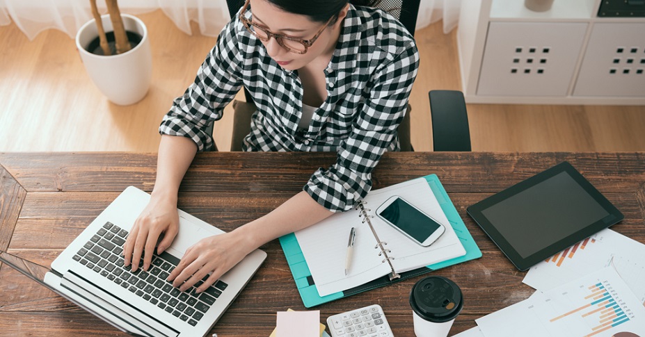 woman researching on laptop