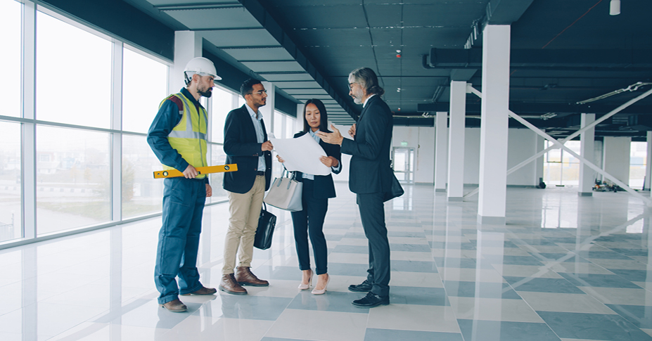Group of investors discussing renovation plans.