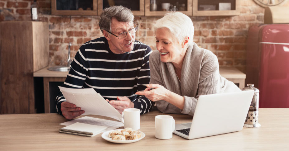 Retired couple reviewing required minimum distributions from an IRA with illiquid assets